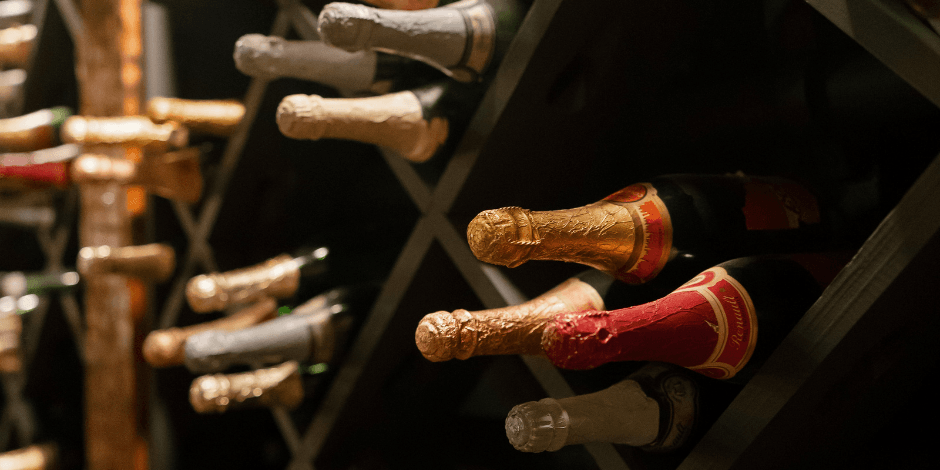 Wine bottles stored in a winery cellar